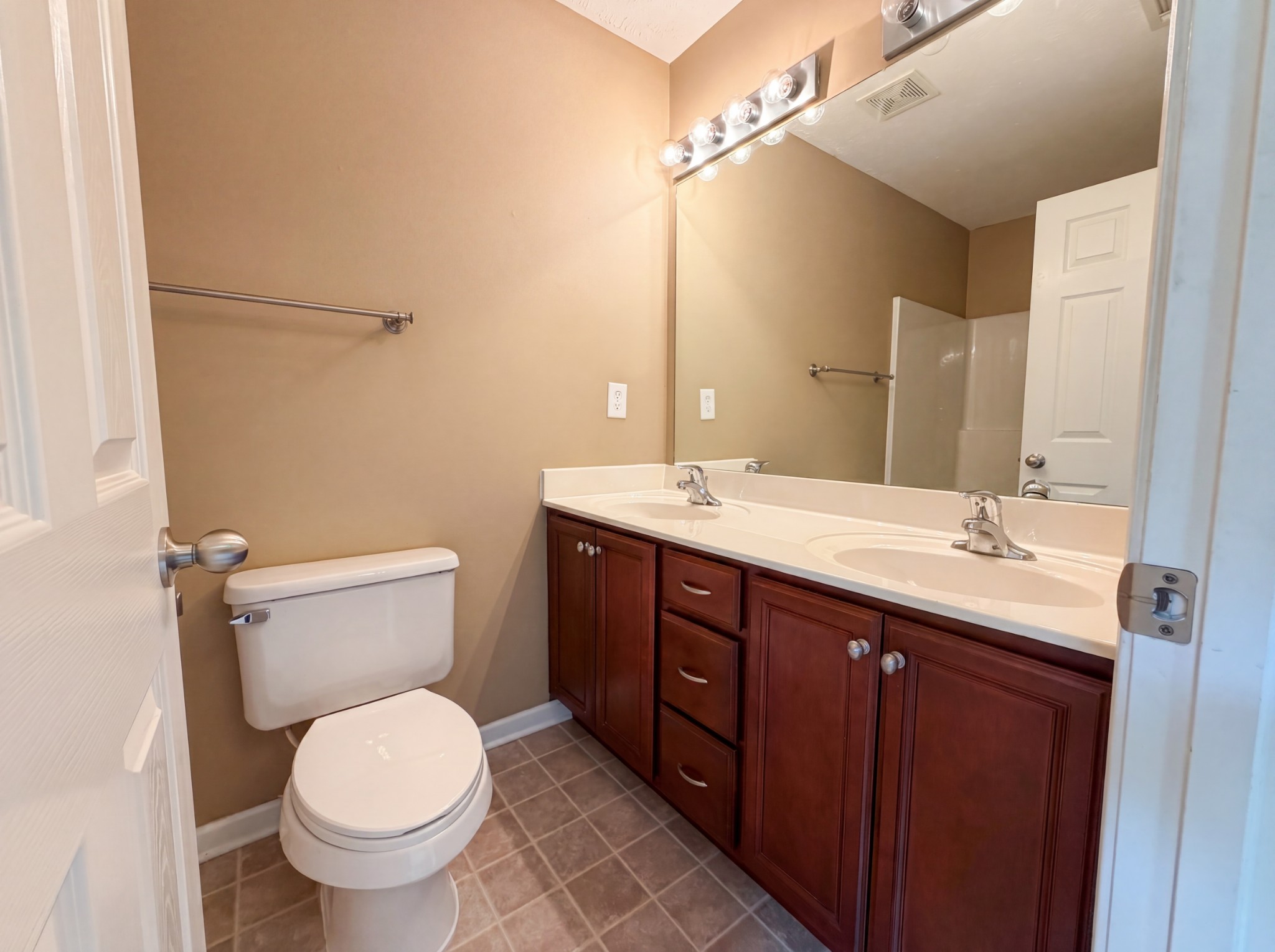 2032 Shaylin Loop Antioch, TN 37013 - Photo 12 of 15 a bathroom with a double vanity sink mirror and toilet