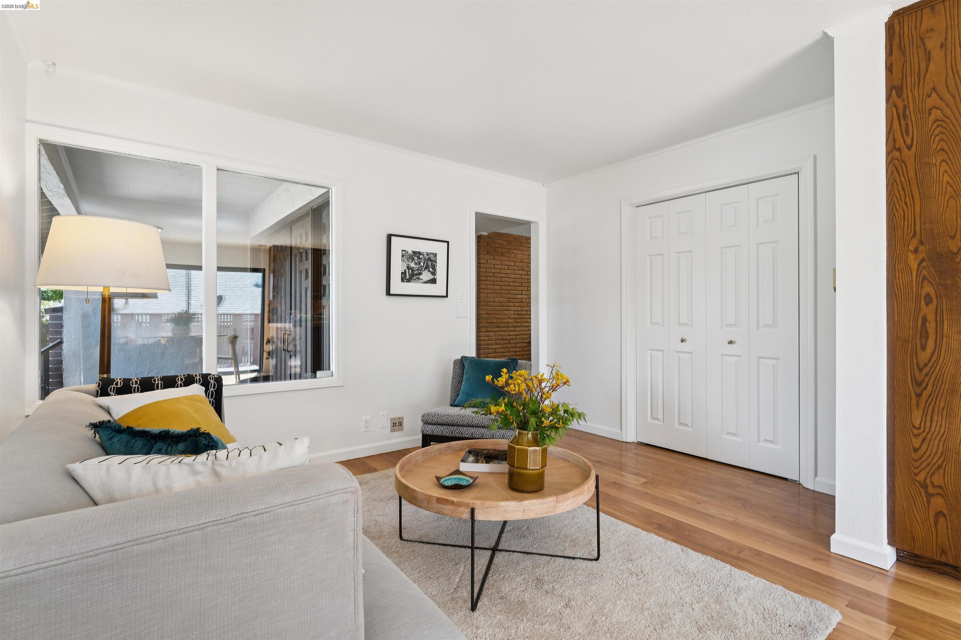 7 Jo Lin Court El Sobrante, CA 94803 - Photo 53 of 99 Living area featuring light wood-finish flooring, white walls, and a large window