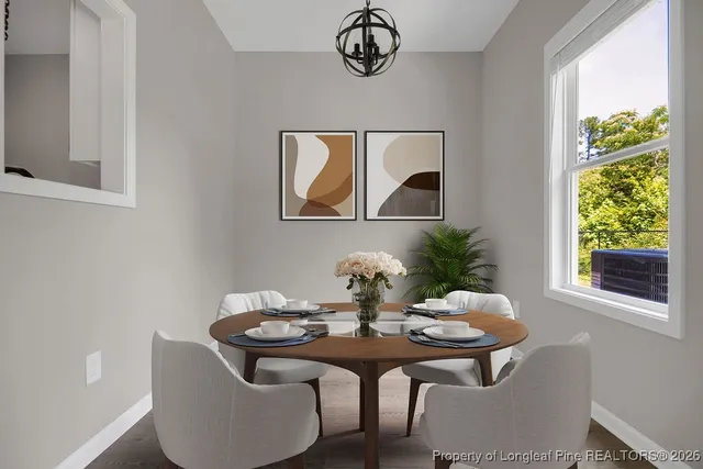 a view of a dining room with furniture and window