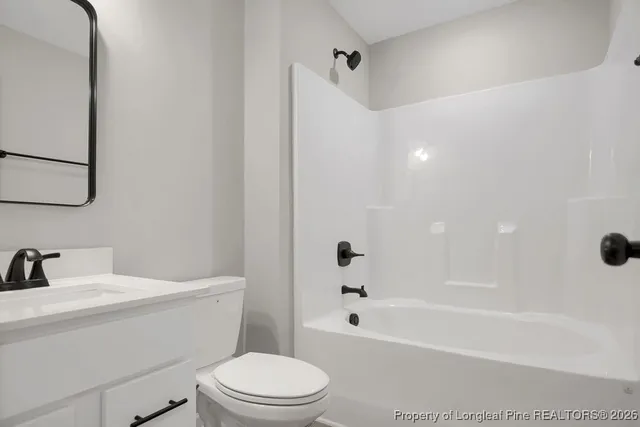 a bathroom with a sink a toilet and a bathtub
