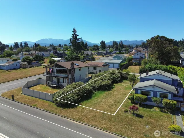 a view of a ocean with a building in the background