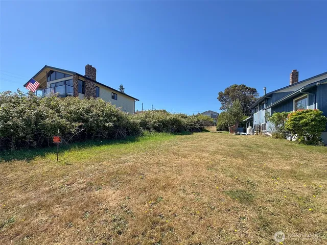 a backyard of a house with lots of green space