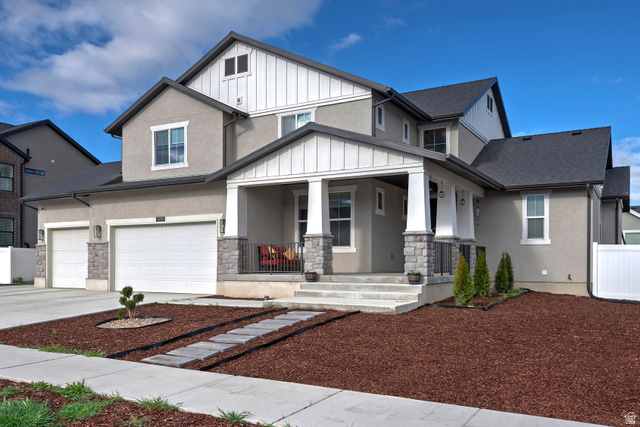 11694 Engelmann Drive Draper, UT 84020 - Photo 2 of 41 View of front of home with a porch, concrete driveway, stone siding, and stucco siding