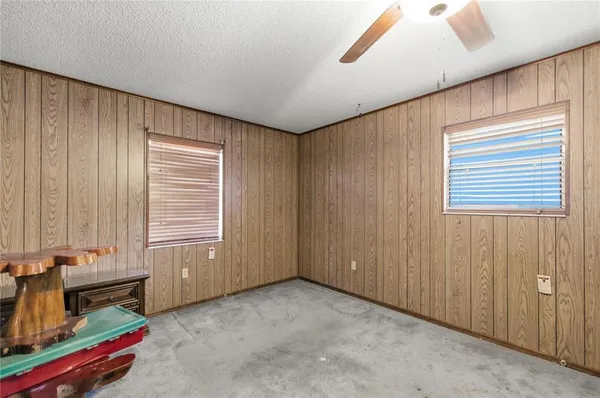 wooden floor with furniture and window in a room