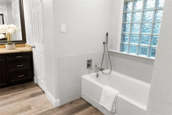 a bathroom with a sink and a bathtub