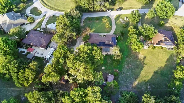an aerial view of residential house with outdoor space and street view
