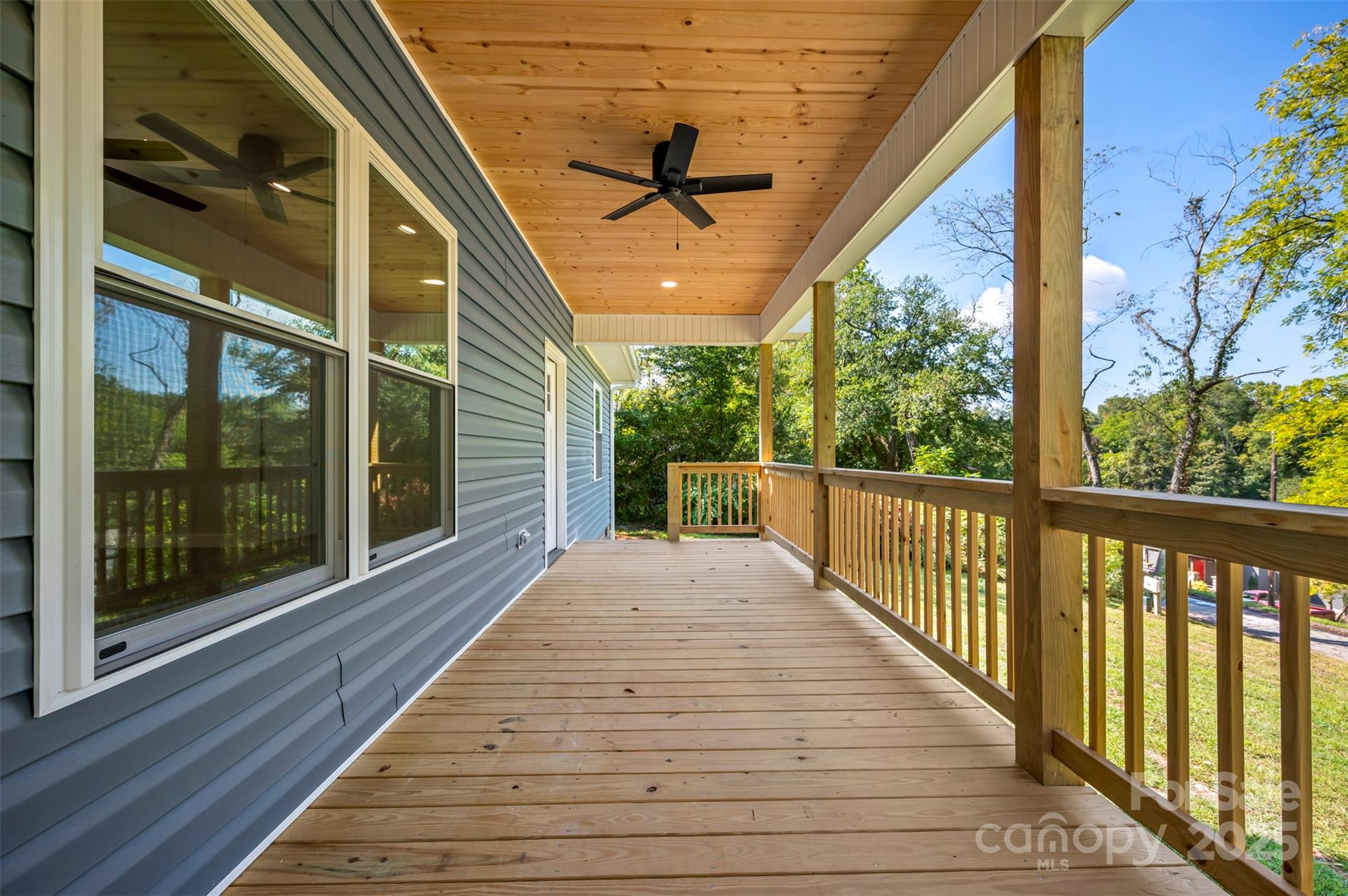 213 Calhoun Street Hendersonville, NC 28739 - Photo 14 of 32 a view of a balcony with wooden floor