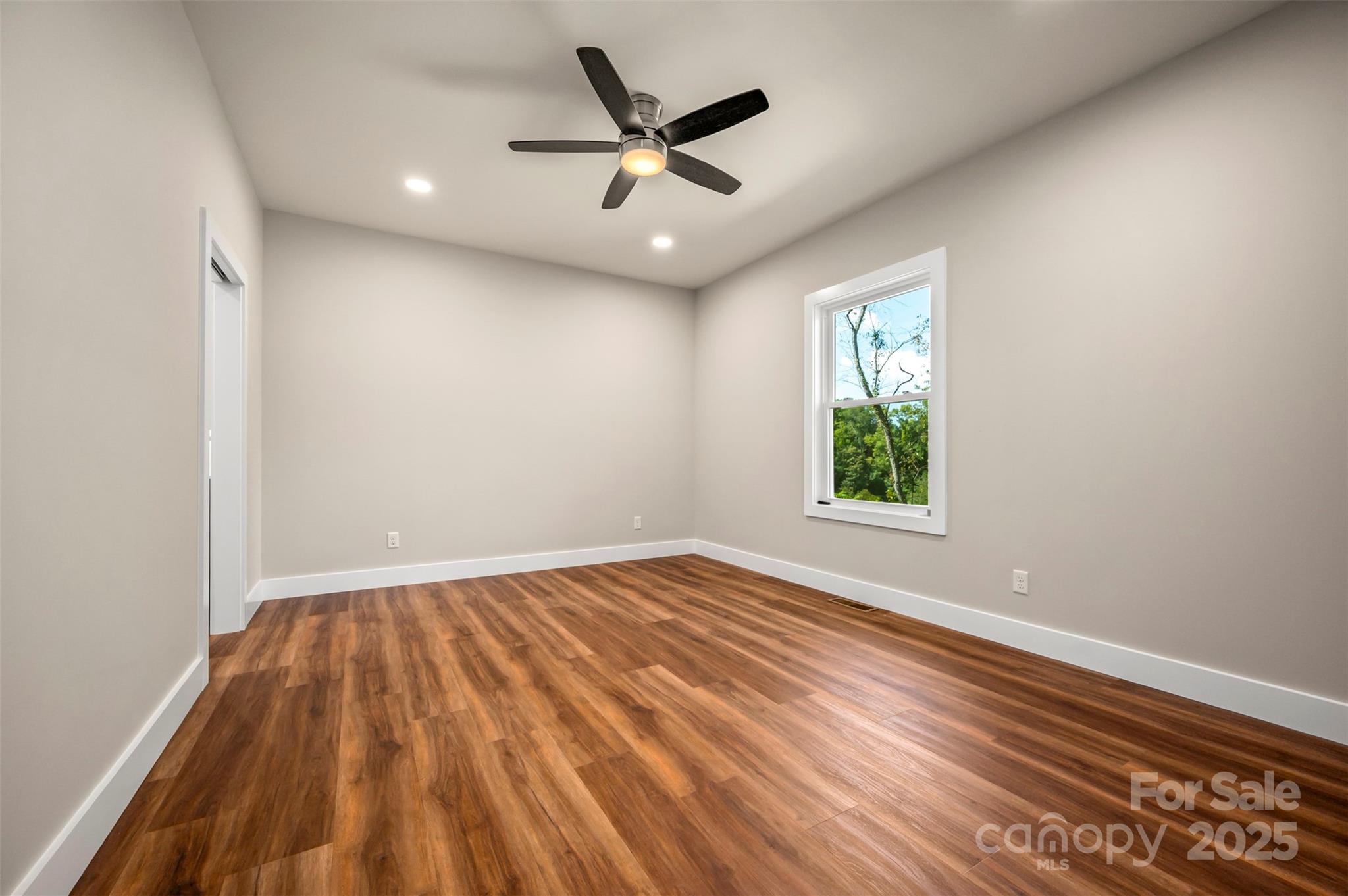 213 Calhoun Street Hendersonville, NC 28739 - Photo 16 of 32 wooden floor in an empty room with a window