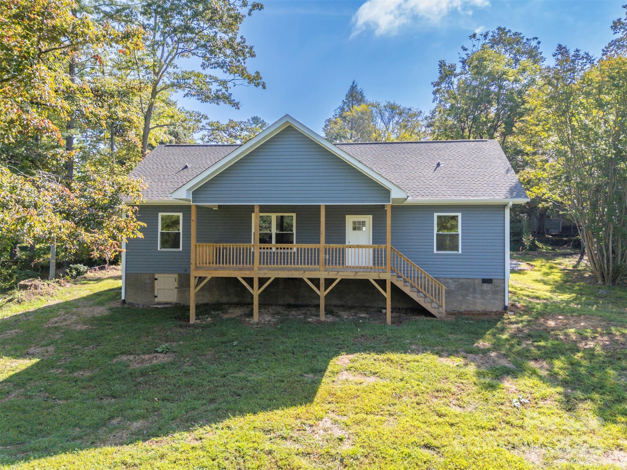 213 Calhoun Street Hendersonville, NC 28739 - Photo 2 of 32 a view of a house with a yard porch and sitting area
