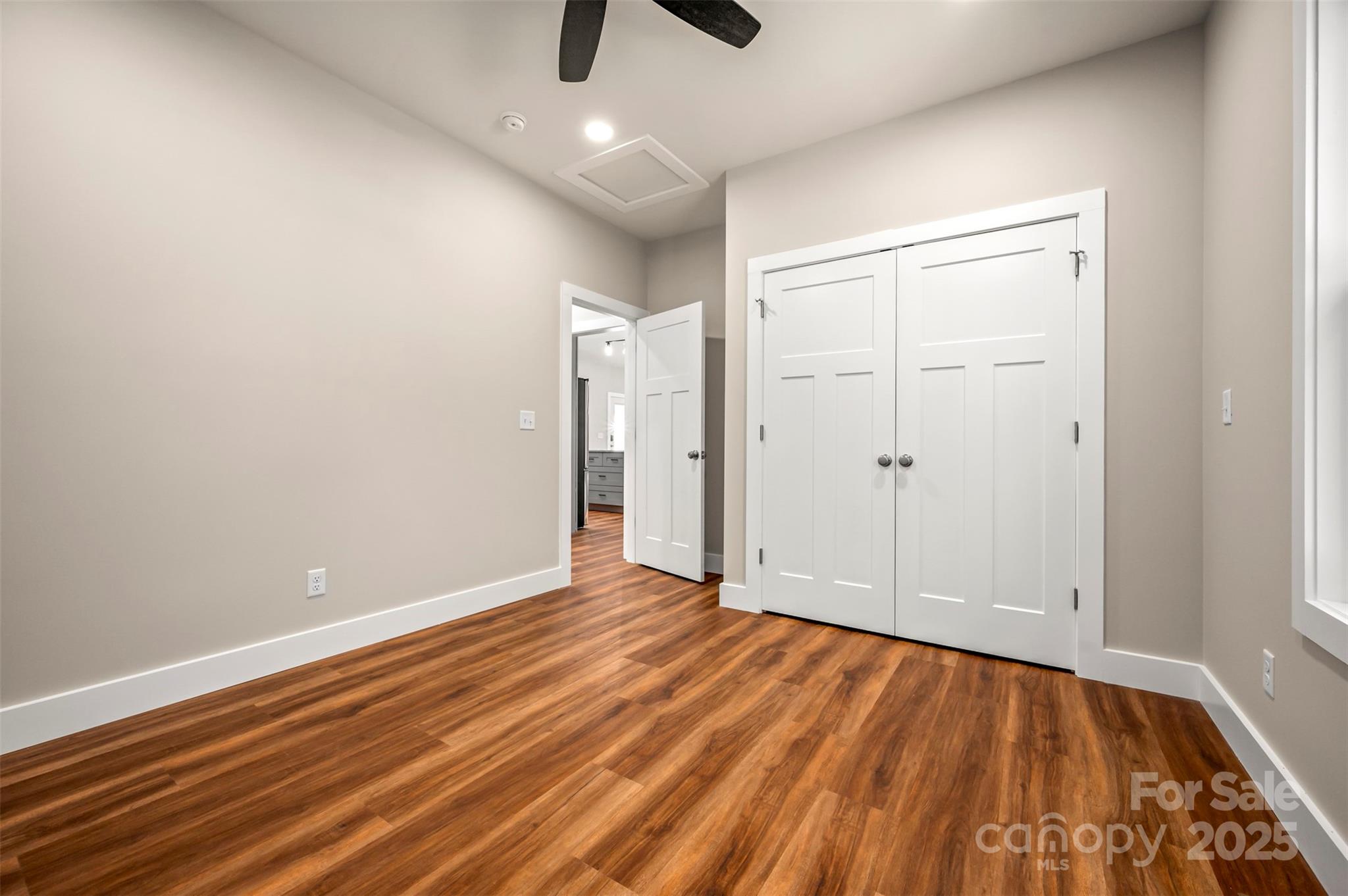 213 Calhoun Street Hendersonville, NC 28739 - Photo 23 of 32 a view of an empty room with wooden floor