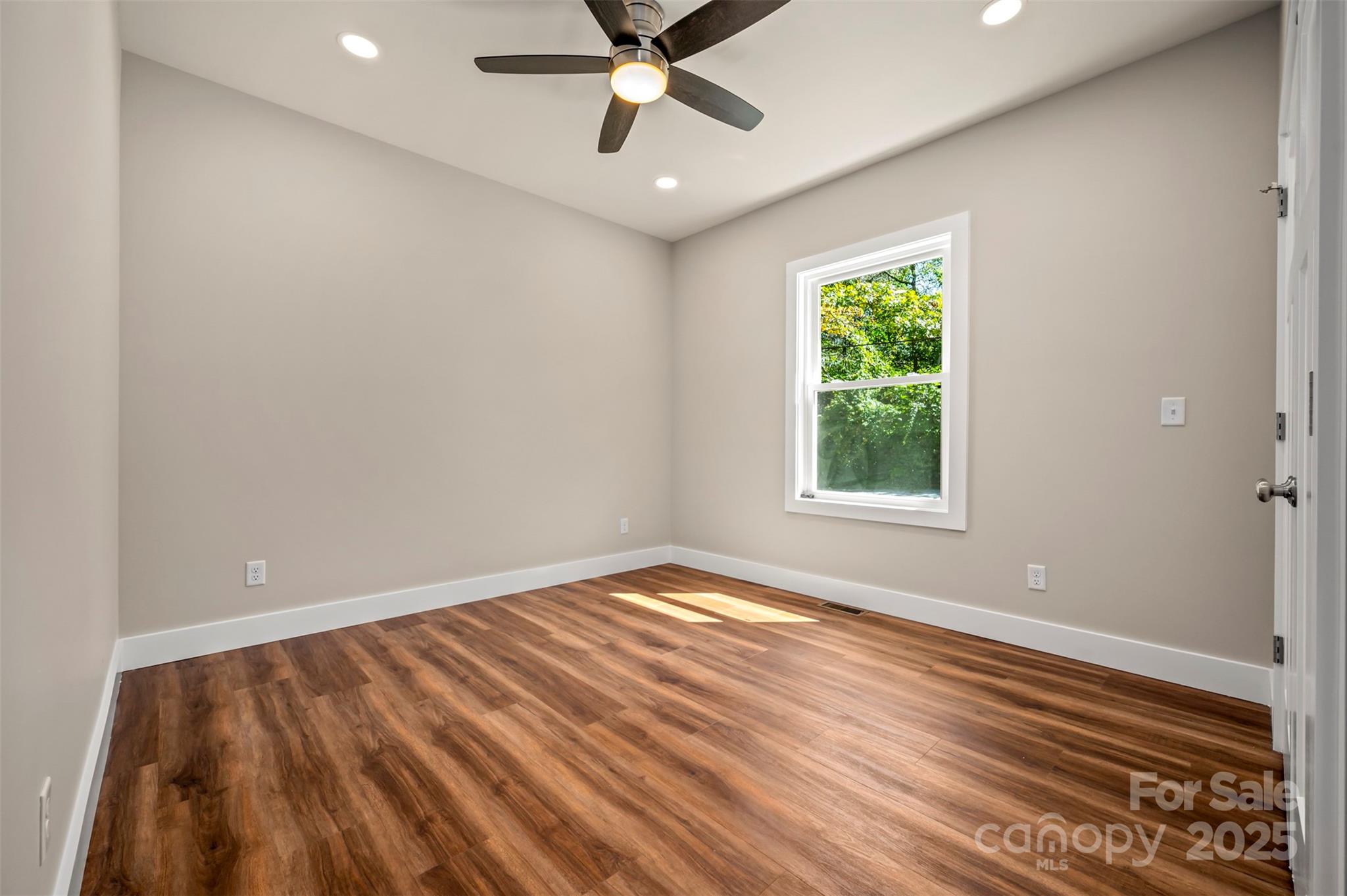 213 Calhoun Street Hendersonville, NC 28739 - Photo 25 of 32 a view of an empty room with a window