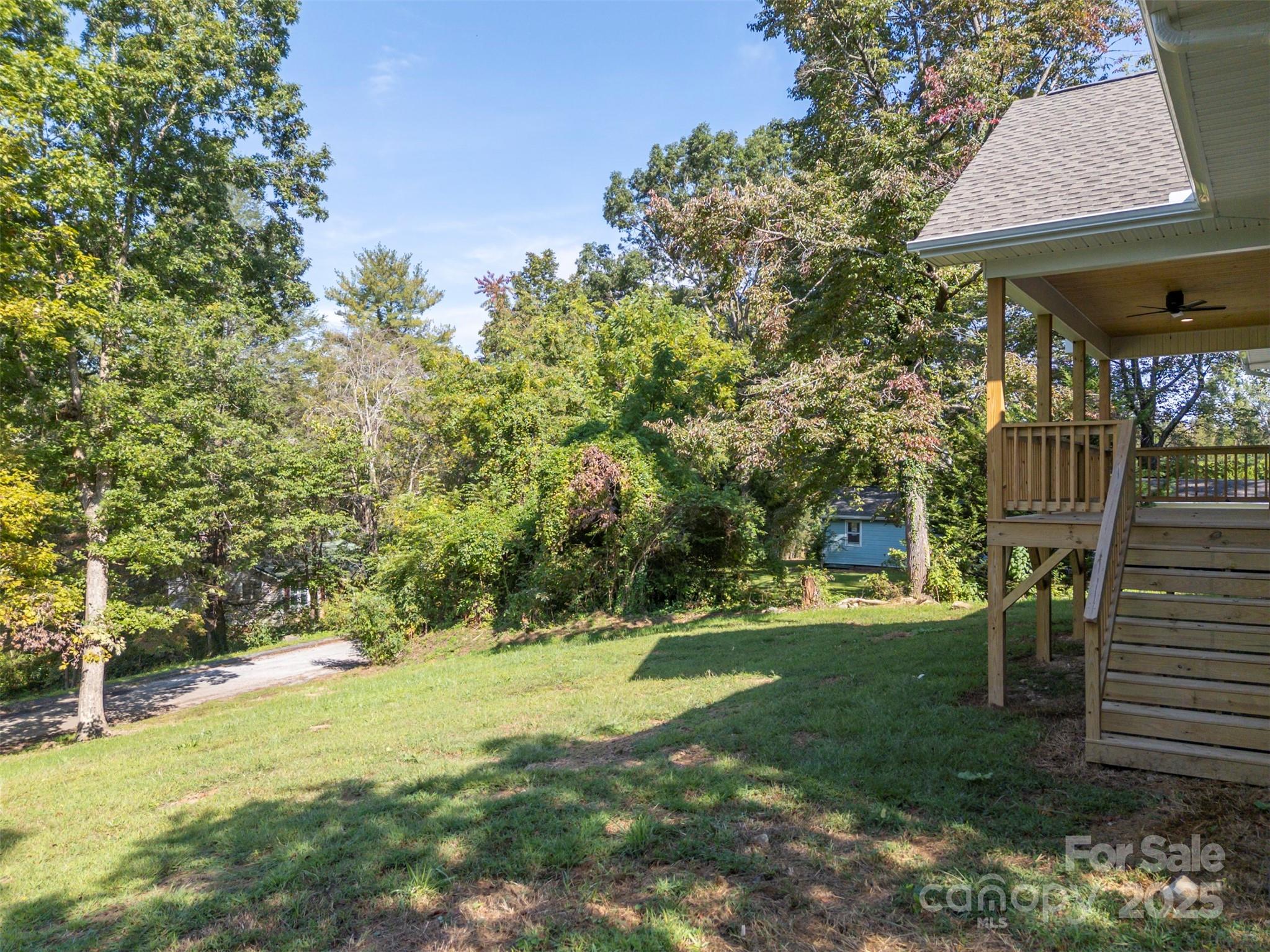 213 Calhoun Street Hendersonville, NC 28739 - Photo 6 of 32 a view of swimming pool with lawn chairs and plants