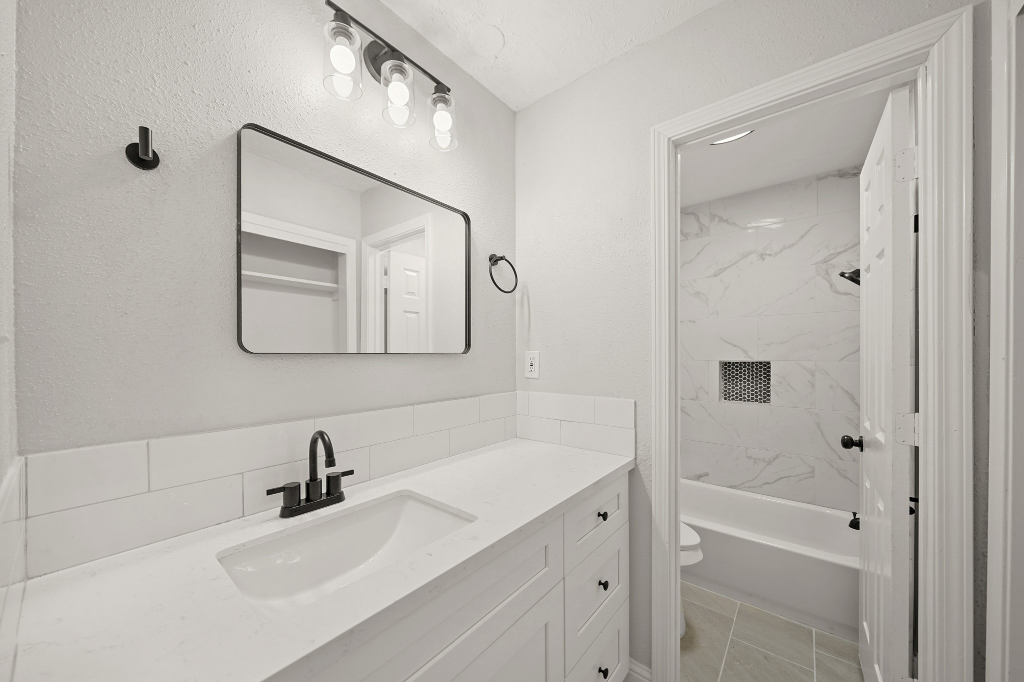 3623 Peachstone Place Spring, TX 77389 - Photo 12 of 20 a bathroom with a sink a toilet and shower