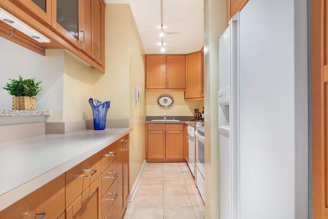 165 West 66th Street, Unit 3R Manhattan, NY 10023 - Photo 3 of 11 a bathroom with a sink and a mirror