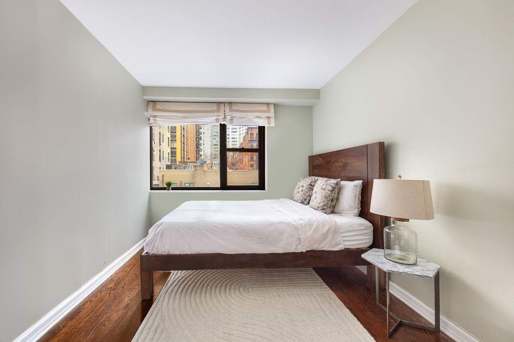 165 West 66th Street, Unit 3R Manhattan, NY 10023 - Photo 4 of 11 a bedroom with a bed and window