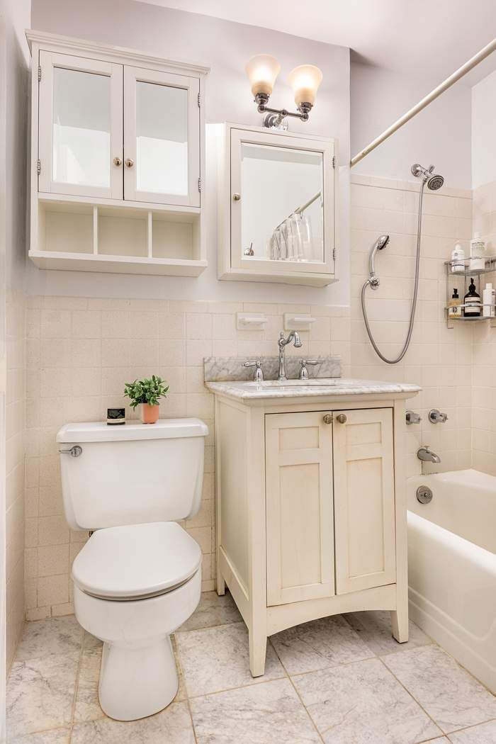 165 West 66th Street, Unit 3R Manhattan, NY 10023 - Photo 5 of 11 a bathroom with a sink a toilet and bathtub