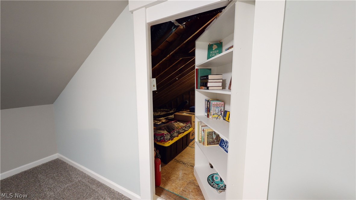 4449 Lander Road Chagrin Falls, OH 44022 - Photo 22 of 31 Second Floor hidden door (disguised as a bookcase!) leading into the walk-in unfinished attic