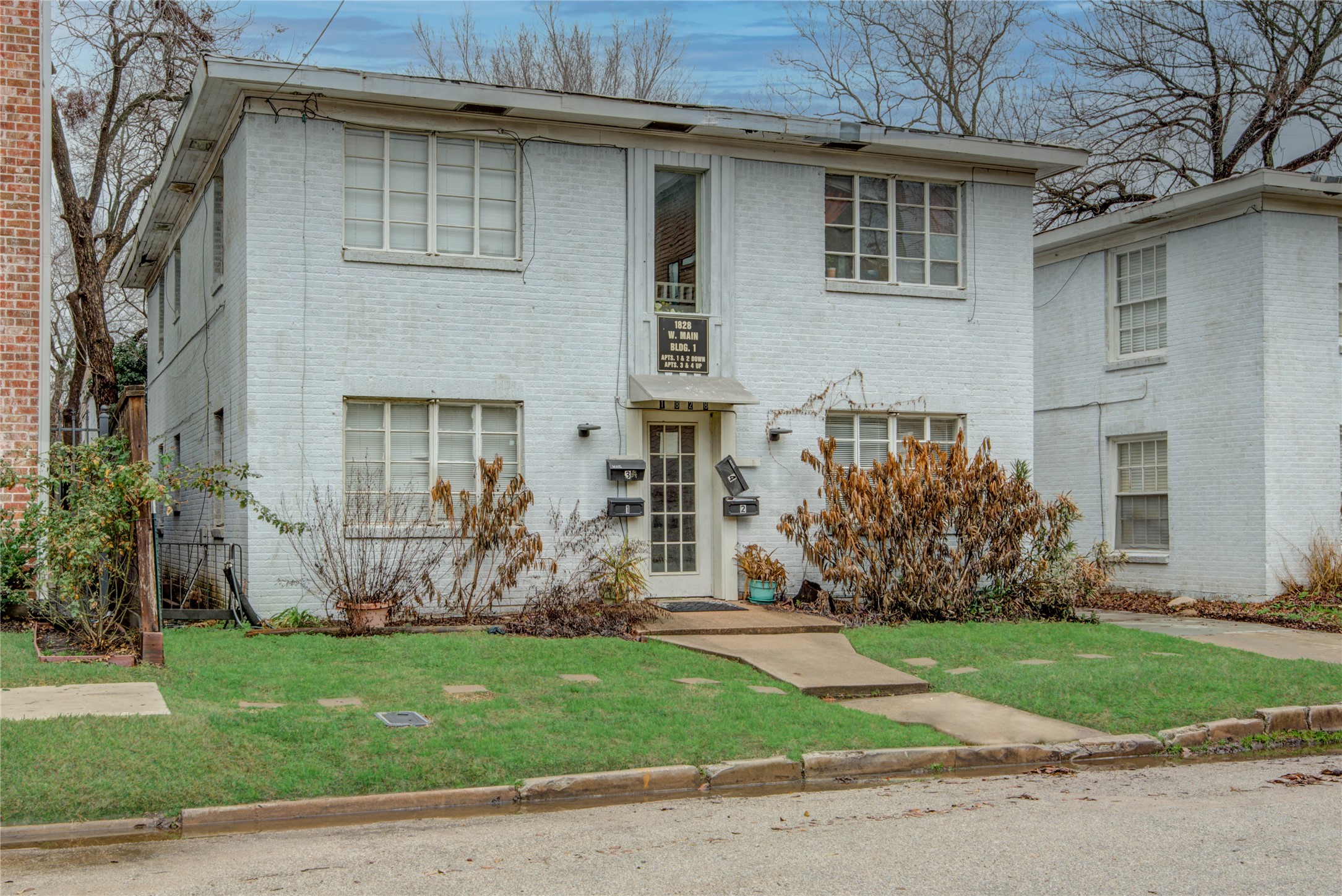 1828 West Main Street, Unit 1 Houston, TX 77098 - Photo 1 of 20 a front view of a house with garden