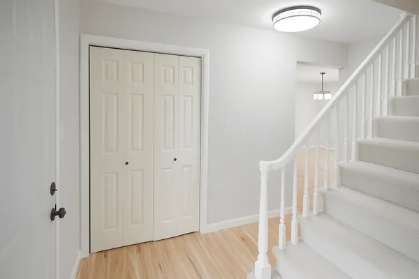 a view of entryway with wooden floor
