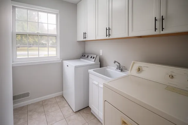 a view of storage and utility room with washer and dryer