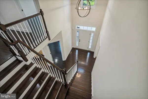 a view of an entryway with wooden floor
