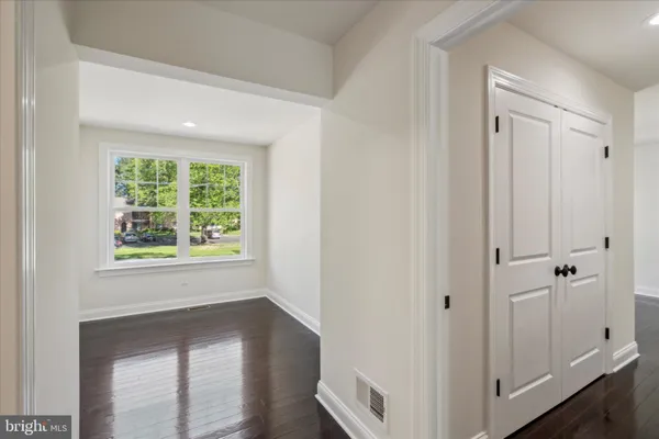 a view of an entryway with wooden floor