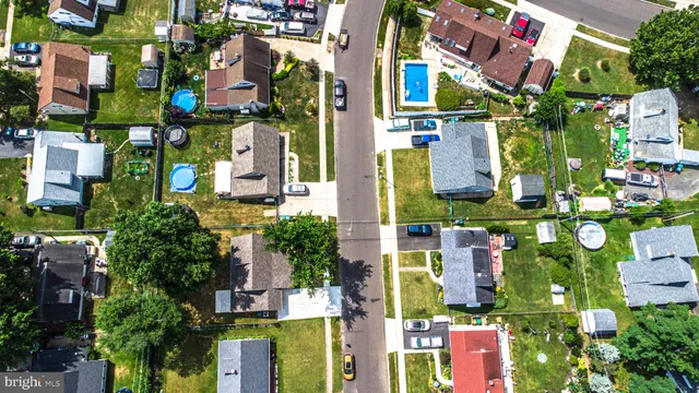 an aerial view of multi story residential apartment building with yard