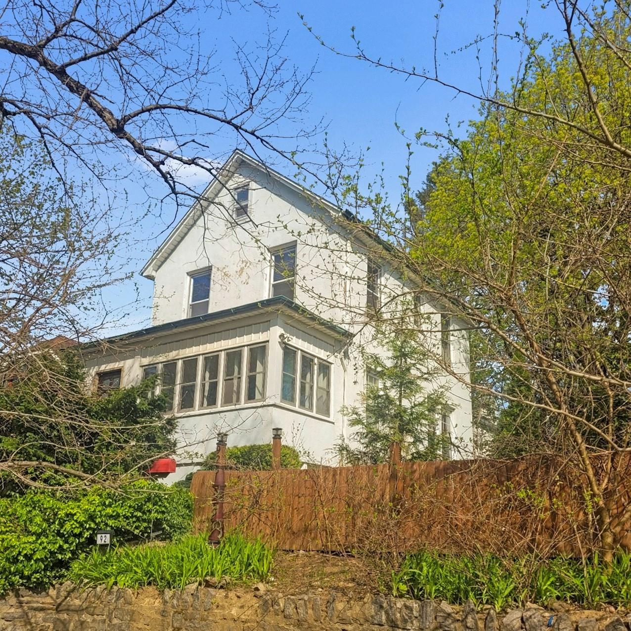 92 Ridgewood Avenue Yonkers, NY 10704 - Photo 1 of 1 a front view of a house with a yard