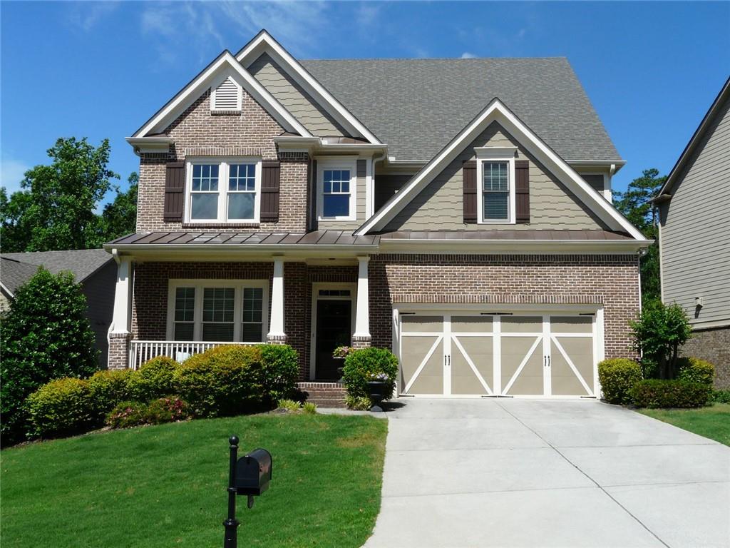 3970 Sweeting Street Cumming, GA 30041 - Photo 1 of 17 a front view of a house with garden