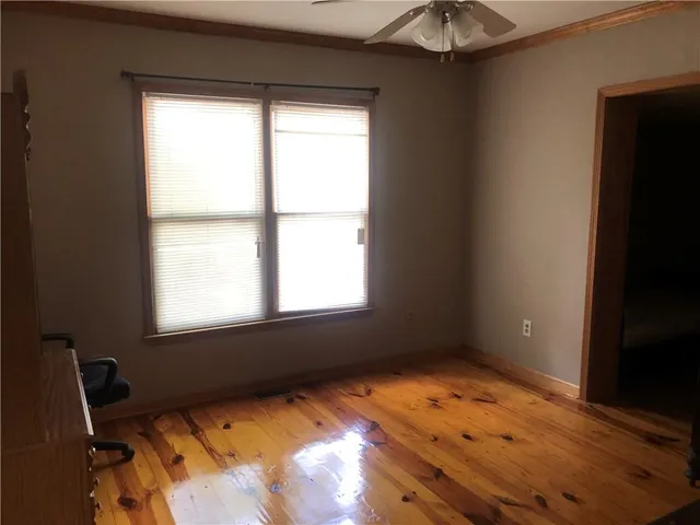a view of a dining room with furniture and window