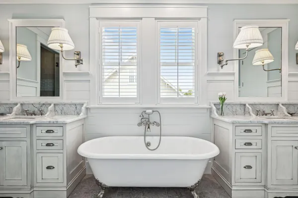 a bath room with a sink and a mirror