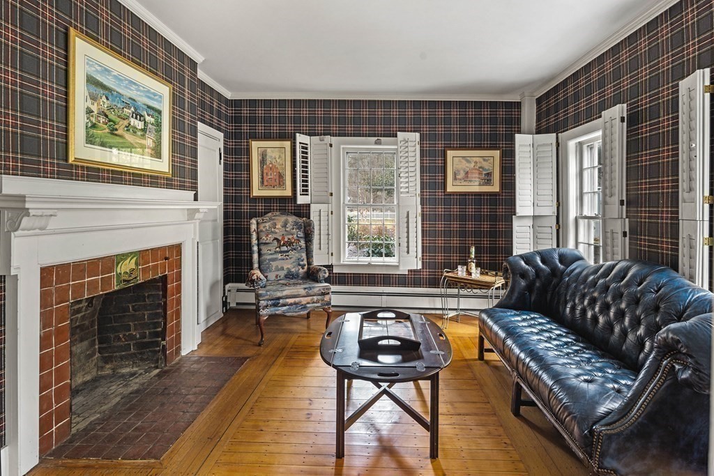607 Broadway Hanover, MA 02339 - Photo 12 of 41 a living room with furniture and a fireplace