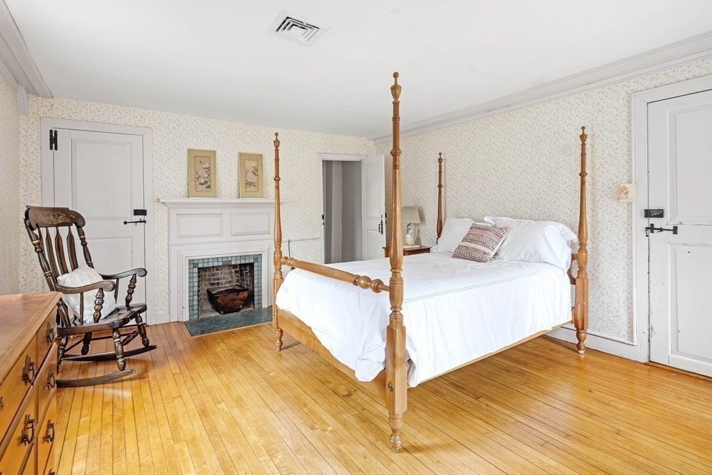 607 Broadway Hanover, MA 02339 - Photo 20 of 41 a spacious bedroom with a bed and a table