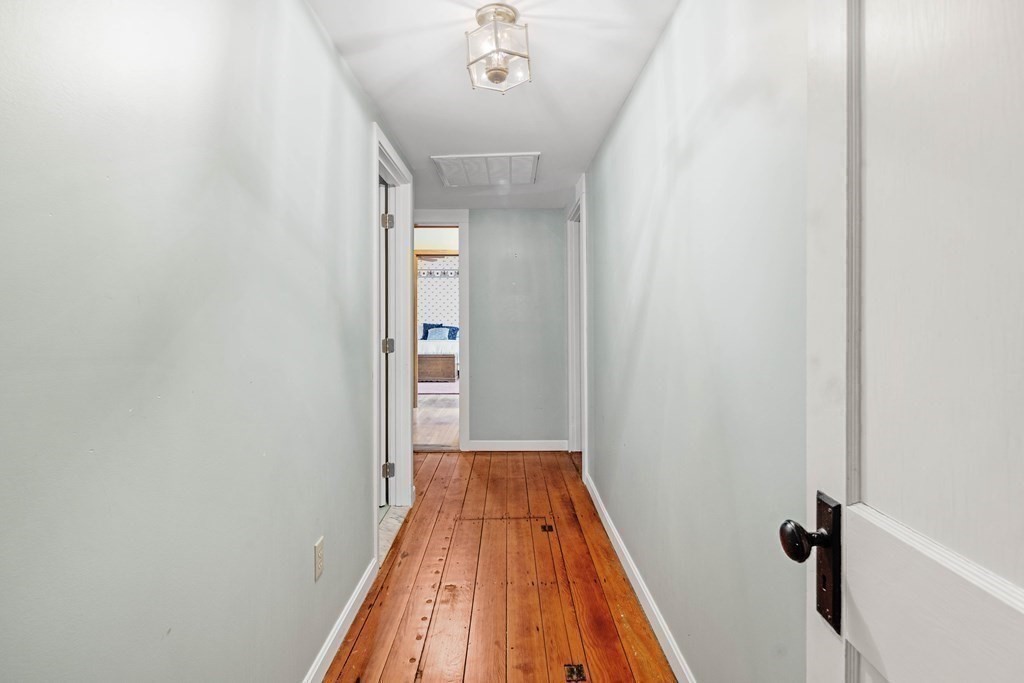 607 Broadway Hanover, MA 02339 - Photo 23 of 41 a view of a hallway with wooden floor