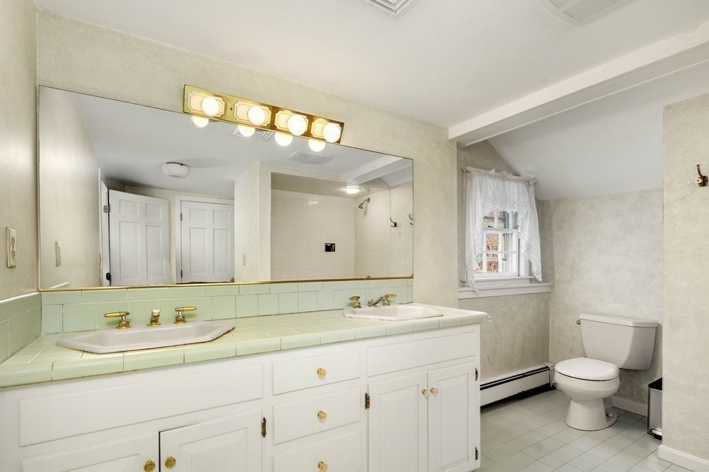 607 Broadway Hanover, MA 02339 - Photo 24 of 41 a bathroom with a granite countertop sink mirror and toilet