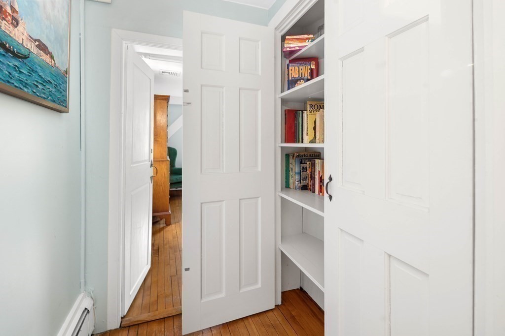 607 Broadway Hanover, MA 02339 - Photo 25 of 41 a view of walk in closet with clothes and shoes