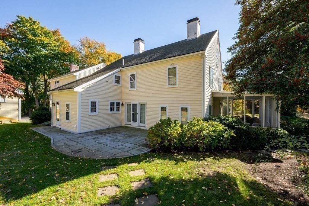 607 Broadway Hanover, MA 02339 - Photo 37 of 41 a view of a house with a yard and plants