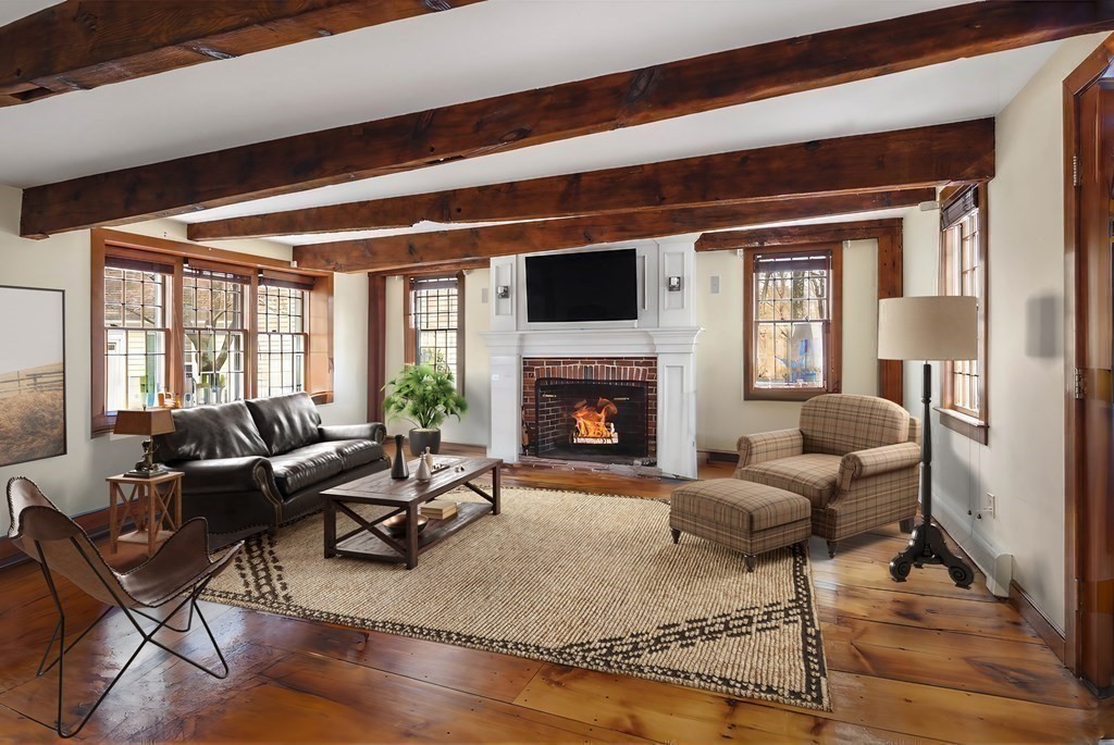 607 Broadway Hanover, MA 02339 - Photo 5 of 41 a living room with furniture fireplace and a table