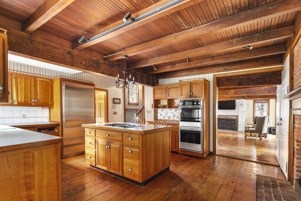 607 Broadway Hanover, MA 02339 - Photo 7 of 41 a kitchen with stainless steel appliances granite countertop a stove a sink and a refrigerator