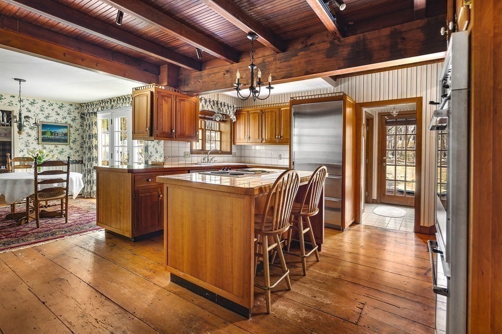 607 Broadway Hanover, MA 02339 - Photo 8 of 41 a kitchen with stainless steel appliances granite countertop a sink and cabinets