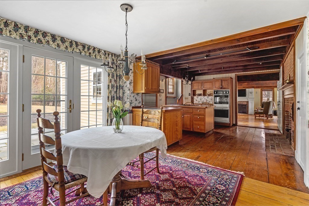 607 Broadway Hanover, MA 02339 - Photo 9 of 41 a view of a dining room with furniture window and wooden floor