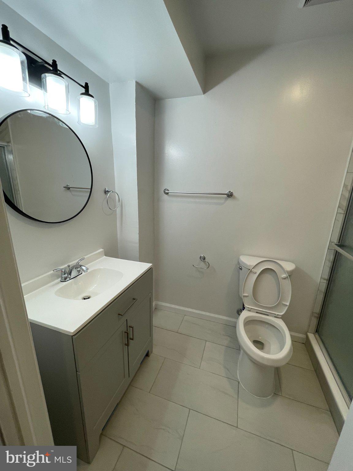 2016 Gatewood Place Silver Spring, MD 20903 - Photo 18 of 24 a bathroom with a toilet sink and mirror