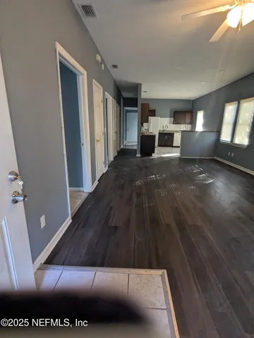 a view of a hallway with stairs