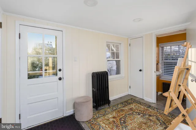 a view of room with window and wooden floor