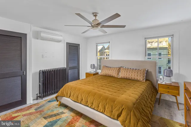 a bedroom with a bed and window