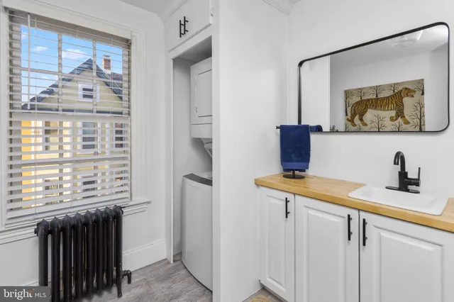 a view of a bathroom with a sink and a mirror