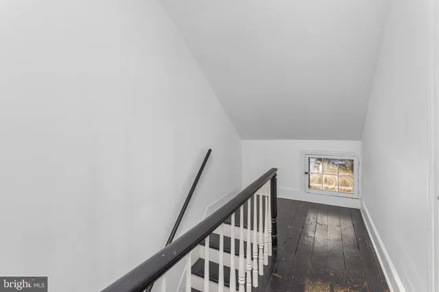 a view of an entryway with wooden floor