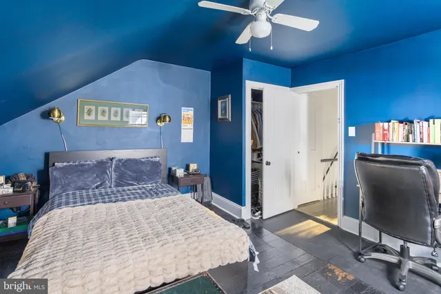 a bed room with a bed and a television