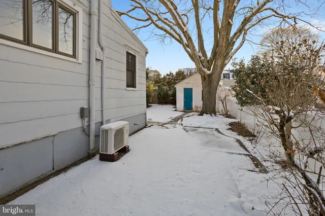 a view of a house with a snow in the yard
