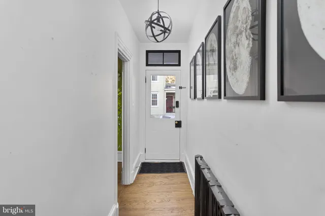 a view of an entryway with wooden floor